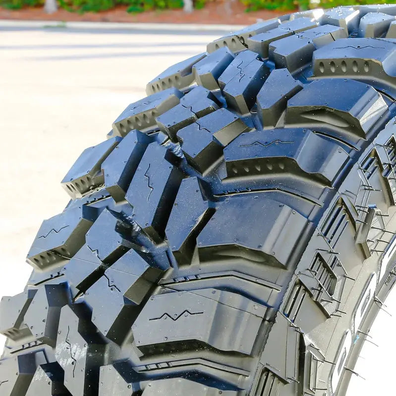 Four Cooper STT Pro LT 275/70R18 E-Rated Mud-Terrain Tires – Aggressive Tread Design